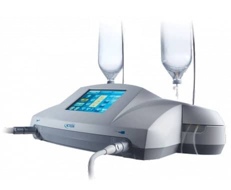 Piezoelectric surgical unit with blue display screen and dual irrigation handpieces for dental procedures.