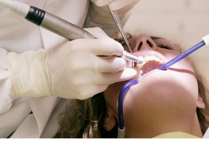 Dentist performing professional teeth whitening treatment on patient in Paradise Valley, AZ.