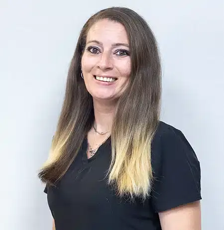 Jessica, dental assistant at Paradise Valley dental practice, smiling at camera.