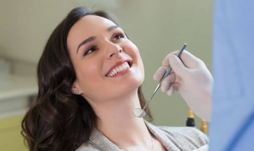 Woman smiling during dental bonding consultation with dentist in Paradise Valley.