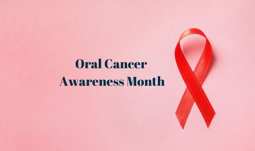 Red ribbon symbolizing oral cancer awareness on pink background for Oral Cancer Awareness Month.