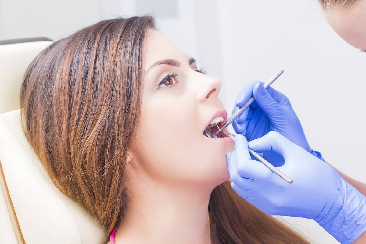 Dentist examining patient's teeth during preventive dental checkup in Paradise Valley.