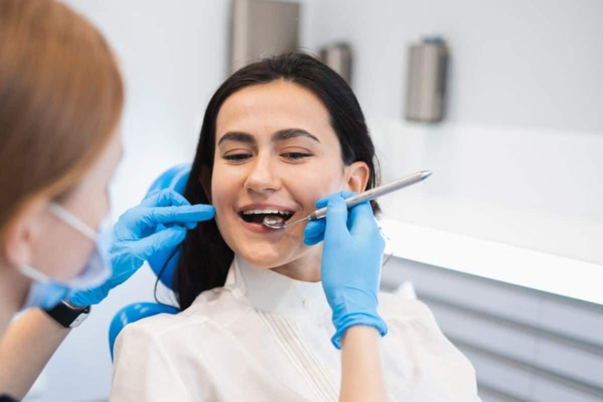 Dentist examining patient's teeth during preventive dental care appointment in Paradise Valley.