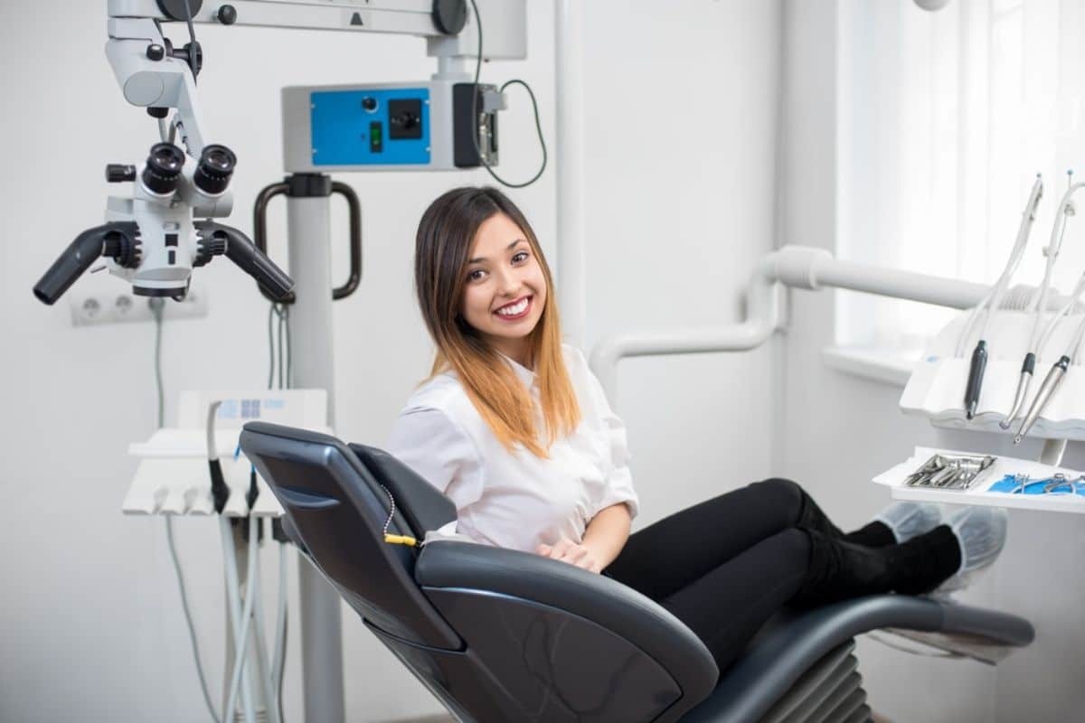 Smiling female dentist sitting in dental chair in modern Paradise Valley, AZ office.
